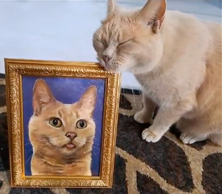 Latte cat really likes her oil portrait
